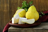 piece of soft cheese with and pears  (brie, camembert)