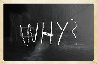 "Why" handwritten with white chalk on a blackboard