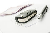 Car key on a contract of car sale
