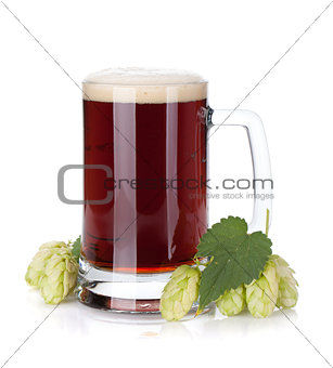 Dark beer mug and hop branch