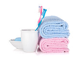 Toothbrushes, soap and two towels
