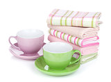 Coffee cups and kitchen towels