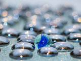 Glass blue pebbles on crystal glass