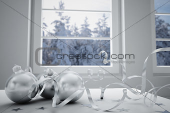 christmas balls on a background winter landscape in a window