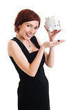 beautiful young woman with piggy bank against white background