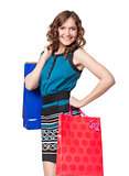 Portrait of young woman carrying shopping bags