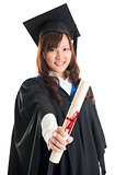 Graduate student showing graduation diploma