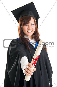 Graduate student showing graduation diploma