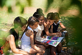 Children and education, kids and girls reading book in park