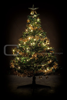 Decorated christmas tree with yellow and green balls 