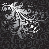 Floral silver design element on black swirls pattern
