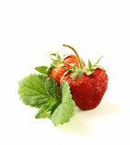 ripe organic strawberries with green leaf