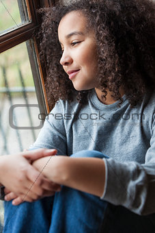 Mixed Race African American Girl Looking Out of Window