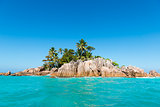 Tropical Island. Calm exotic beach resort in background