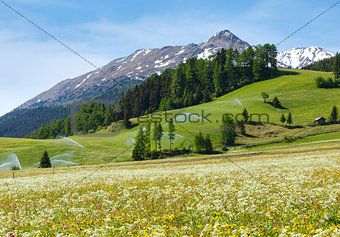 Irrigation water spouts in Summer Alps mountain 