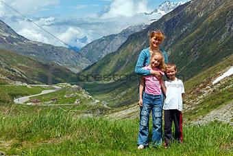 Family  on summer Alps mountain 