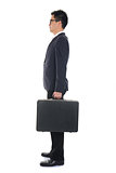 asian business male standing and holding a suitcase ,full body s