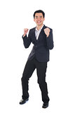 chinese asian business success male jumping in joy with isolated