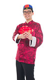 Happy Southeast Asian Chinese male in cheongsam hands holding tw