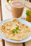 roti canai and teh tarik, very famous drink and food in malaysia