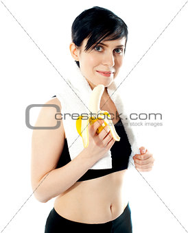 Pretty woman with banana