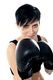 Attractive caucasian girl practicing boxing