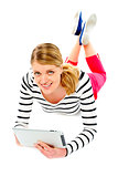 Young woman holding her tablet computer