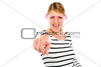 Excited woman pointing at you