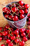 Fresh cherries in a small bucket