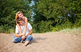 couple sitting on a sand