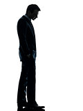 sad business man  looking down silhouette