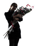 business woman hugging flowers bouquet silhouette