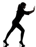 business woman pushing silhouette