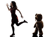 strange young woman and killer teddy bear silhouette