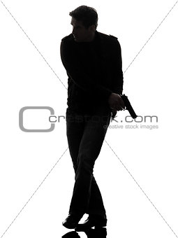 man killer policeman holding gun walking silhouette
