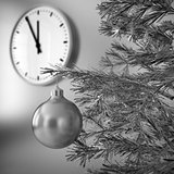 christmas tree with decorations on a background wall and clock