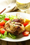 fried chicken with salad and vegetables