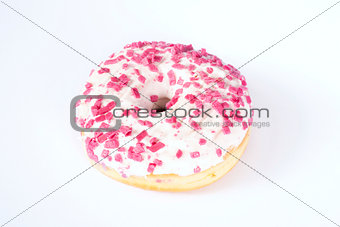 Donut with white glazing and pink sprinkles