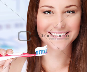 Woman brushing her teeth