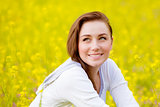 Woman on yellow floral field