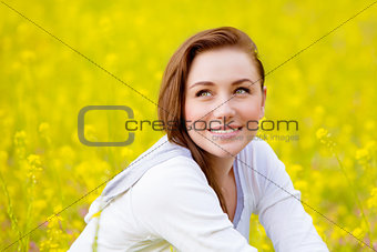 Woman on yellow floral field