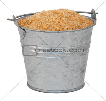 Demerera sugar in a miniature metal bucket