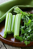 fresh celery sticks on a wooden table, rustic style