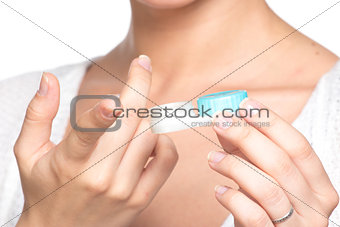 Contact lenses box in womans hand