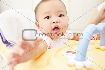 Baby reaching to camera
