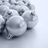 Christmas toys of silver color in the form of spheres on a white background