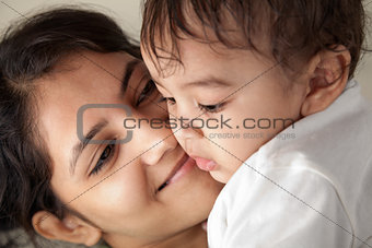 Indian mother and baby smiling