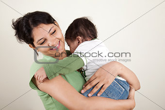 Indian mother and baby smiling