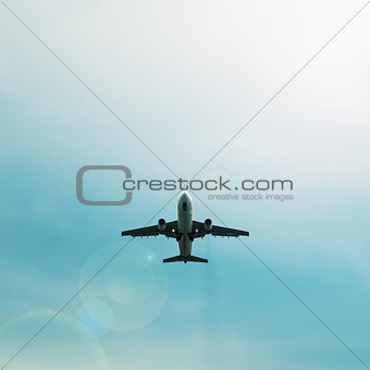 Silhouette of passenger airplane flying in the sky