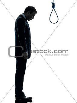 man sad standing in front of  hangman noose silhouette